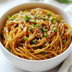 Für die würzigen Knoblauch-Sesam-Nudeln benötigst du: - 225 g Spaghetti oder eine Nudelsorte nach Wahl - 4 Esslöffel Sesamöl - 4 Knoblauchzehen, fein gehackt - 1 Stück Ingwer (ca. 2,5 cm), gerieben - 2 Esslöffel Sojasauce - 2 Esslöffel Reisessig - 2 Esslöffel Chilipaste (anzupassen je nach Schärfewunsch) - 1 Esslöffel Honig oder Ahornsirup - 1 Esslöffel geröstete Sesamsamen - 3 Frühlingszwiebeln, in Ringe geschnitten - Frischer Koriander, zur Garnitur (optional) - Salz und Pfeffer nach Geschmack Jede Zutat in diesem Rezept hat ihren eigenen Wert: - Spaghetti: Hauptbestandteil, liefert Energie durch Kohlenhydrate. - Sesamöl: Gibt einen nussigen Geschmack und ist reich an gesunden Fetten. - Knoblauch: Hat viele gesundheitliche Vorteile. Er stärkt das Immunsystem. - Ingwer: Hilft bei der Verdauung und ist entzündungshemmend. - Sojasauce: Fügt Umami hinzu und macht die Sauce herzhaft. - Reisessig: Bringt eine angenehme Säure, die die Aromen ausgleicht. - Chilipaste: Bestimmt die Schärfe, die du magst. - Honig oder Ahornsirup: Süßt die Sauce und balanciert die Schärfe. - Geröstete Sesamsamen: Fügen Crunch und Geschmack hinzu. - Frühlingszwiebeln und Koriander: Frische und Farbe für die Garnitur. Du kannst viele Zutaten leicht ersetzen: - Nudeln: Verwende Reisnudeln oder Udon für Abwechslung. - Sesamöl: Ersetze es durch Olivenöl für einen anderen Geschmack. - Chilipaste: Nutze Sriracha oder frische Chilis für andere Schärfegrade. - Honig: Agavendicksaft ist eine gute vegane Option. - Frühlingszwiebeln: Stattdessen kannst du auch Schalotten verwenden. Diese Anpassungen helfen dir, das Rezept nach deinem Geschmack zu gestalten. Probiere verschiedene Kombinationen aus! {{ingredient_image_2}} Kochen Sie einen großen Topf mit gesalzenem Wasser. Bringen Sie das Wasser zum Kochen. Fügen Sie 225 g Spaghetti oder eine andere Nudelart hinzu. Kochen Sie die Nudeln nach Packungsanleitung, bis sie al dente sind. Achten Sie darauf, das Nudelwasser aufzuheben! Erhitzen Sie 2 Esslöffel Sesamöl in einer großen Pfanne bei mittlerer Hitze. Fügen Sie 4 fein gehackte Knoblauchzehen und 2,5 cm geriebenen Ingwer hinzu. Dünsten Sie für 1-2 Minuten. Die Mischung soll duften, aber nicht bräunen. Rühren Sie dann 2 Esslöffel Sojasauce, 2 Esslöffel Reisessig, 2 Esslöffel Chilipaste und 1 Esslöffel Honig oder Ahornsirup ein. Lassen Sie die Sauce 2 Minuten köcheln. Geben Sie die gekochten Nudeln in die Pfanne. Schwenken Sie die Nudeln gut in der Sauce. Wenn die Mischung zu trocken ist, fügen Sie nach und nach etwas Nudelwasser hinzu. Nehmen Sie die Pfanne vom Herd. Rühren Sie 2 Esslöffel Sesamöl, 1 Esslöffel geröstete Sesamsamen und die geschnittenen Frühlingszwiebeln unter. Schmecken Sie mit Salz und Pfeffer ab. Servieren Sie die Nudeln in Schalen und garnieren Sie sie mit frischem Koriander, wenn gewünscht. Um die Schärfe deiner Spicy Garlic Sesame Noodles anzupassen, nutze die Chilipaste. Füge weniger hinzu, wenn du es milder magst. Du kannst auch frische Chilis oder Chiliöl verwenden. Diese Optionen geben dir mehr Kontrolle über die Schärfe. Diese Nudeln sind flexibel! Du kannst sie mit Gemüse wie Paprika oder Brokkoli anreichern. Auch Erdnüsse oder Cashewkerne bringen zusätzlichen Crunch. Experimentiere mit verschiedenen Kräutern, wie Minze oder Basilikum, für neue Geschmäcker. Ich empfehle, Spaghetti zu verwenden, da sie die Sauce gut halten. Du kannst aber auch Reisnudeln oder Vollkornnudeln ausprobieren. Jede Nudelart bringt ihren eigenen Charakter in das Gericht. Achte darauf, die Kochzeit je nach Nudelart anzupassen. Pro Tipps Nudeln al dente kochen: Achten Sie darauf, die Nudeln nur bis zum al dente zu kochen, damit sie beim Mischen mit der Sauce nicht zu weich werden. Schärfe anpassen: Die Menge der Chilipaste kann je nach Vorliebe angepasst werden. Beginnen Sie mit weniger und fügen Sie nach Geschmack mehr hinzu. Frische Zutaten verwenden: Frischer Koriander und knackige Frühlingszwiebeln verleihen dem Gericht zusätzlichen Geschmack und Textur. Verwenden Sie sie großzügig! Restliche Sauce aufbewahren: Falls Sie Sauce übrig haben, können Sie diese in einem luftdichten Behälter im Kühlschrank aufbewahren und für andere Gerichte verwenden. {{image_4}} Wenn Sie eine vegetarische oder vegane Mahlzeit möchten, sind diese Nudeln perfekt. Sie können die Honig- oder Ahornsirup-Option einfach weglassen oder durch einen pflanzlichen Süßstoff ersetzen. Verwenden Sie stattdessen auch eine Sojasauce, die ohne tierische Produkte ist. Kombinieren Sie die Nudeln mit frischem Gemüse wie Brokkoli oder Paprika. Das gibt Farbe und Nährstoffe. So bleibt das Gericht leicht und lecker. Um mehr Protein hinzuzufügen, probieren Sie Hähnchen oder Tofu. Braten Sie das Hähnchen in der Pfanne, bis es goldbraun ist. Schneiden Sie es in Stücke und mischen Sie es mit den Nudeln. Tofu ist eine tolle vegane Option. Braten Sie den Tofu an, bis er knusprig ist. Fügen Sie ihn dann in die Pfanne. Diese Zutaten machen die Nudeln sättigender und helfen Ihnen, sich länger satt zu fühlen. Nüsse bringen einen tollen Crunch in die Nudeln. Erdnüsse sind klassisch und geben einen schönen Geschmack. Rösten Sie die Erdnüsse leicht und streuen Sie sie über die Nudeln. Cashewkerne sind eine andere leckere Wahl. Sie sind weich und cremig. Diese Ergänzungen machen das Gericht interessanter und fördern die Textur. Außerdem sind sie eine gute Quelle für gesunde Fette. Um die Spicy Garlic Sesame Noodles richtig zu lagern, lassen Sie die Reste zuerst abkühlen. Verwenden Sie dann einen luftdichten Behälter. Stellen Sie sicher, dass nicht zu viel Luft im Behälter ist. So bleibt der Geschmack frisch. Lagern Sie die Nudeln nicht länger als drei Tage im Kühlschrank. Für die Aufbewahrung im Kühlschrank ist ein luftdichter Behälter wichtig. So bleiben die Nudeln saftig und lecker. Wenn Sie sie länger aufbewahren wollen, frieren Sie sie ein. Nutzen Sie dafür einen speziellen Gefrierbehälter oder Gefrierbeutel. So bleiben die Nudeln bis zu drei Monate frisch. Achten Sie darauf, das Datum auf dem Behälter zu notieren. Beim Wiederaufwärmen der Nudeln gibt es einige einfache Tipps. Nehmen Sie die Nudeln zuerst aus dem Kühlschrank oder Gefrierschrank. Lassen Sie sie kurz bei Raumtemperatur stehen. Geben Sie die Nudeln dann in eine Pfanne mit etwas Wasser oder Brühe. So bleiben sie nicht trocken. Erhitzen Sie sie bei mittlerer Hitze, bis sie warm sind. Rühren Sie gelegentlich um. Wenn Sie möchten, fügen Sie etwas frisches Sesamöl hinzu. Das gibt extra Geschmack. Die Spicy Garlic Sesame Noodles halten sich im Kühlschrank etwa 3 bis 5 Tage. Lagere sie in einem luftdichten Behälter. Wenn du die Nudeln länger aufbewahren möchtest, friere sie ein. So bleiben sie bis zu drei Monate frisch. Beim Auftauen sind sie schnell wieder genießbar. Ja, diese Nudeln eignen sich hervorragend für Meal Prep. Koche eine große Portion und teile sie in einzelne Behälter auf. Du kannst die Portionen dann nach Bedarf aufwärmen. Denke daran, die Sauce separat hinzuzufügen, um die Nudeln frisch zu halten. Dies sorgt dafür, dass der Geschmack erhalten bleibt. Um die Sauce milder zu machen, reduziere die Menge an Chilipaste. Du kannst auch etwas mehr Honig oder Ahornsirup hinzufügen. Diese Süße hilft, die Schärfe auszugleichen. Eine weitere Möglichkeit ist, etwas mehr Sojasauce oder Reisessig hinzuzufügen. Dadurch bleibt der Geschmack erhalten, während die Schärfe verringert wird. Im Artikel haben wir die Zutaten und ihre Nahrungsrelevanz detailliert betrachtet. Du hast gelernt, wie du die Nudeln zubereitest und die perfekte Sauce herstellst. Wir sprachen auch über Tipps zur Geschmacksanpassung und verschiedene Variationen. Zum Schluss gab es wichtige Hinweise zur Lagerung. Du hast jetzt alles, was du brauchst, um köstliche Spicy Garlic Sesame Noodles zuzubereiten. Lass deiner Kreativität freien Lauf und genieße jede Gabel!